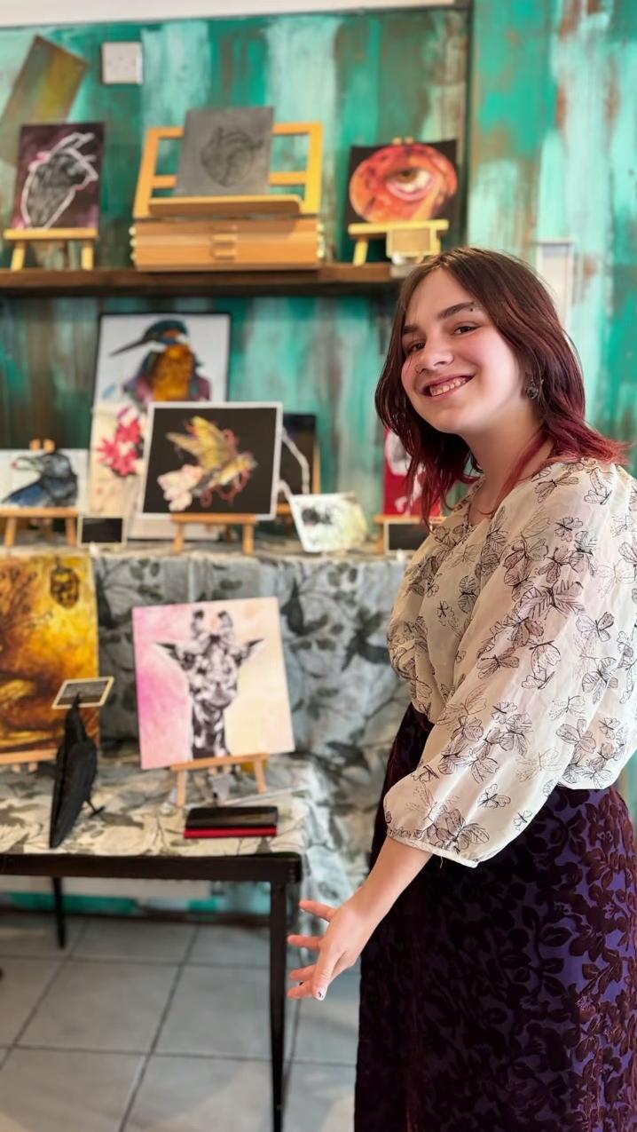 Elizabeth Rutland displaying artwork