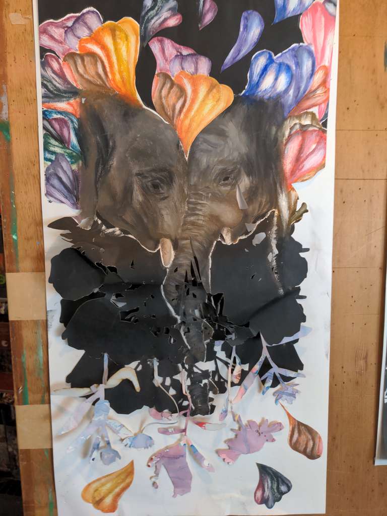Two elephants headbutting with flowers